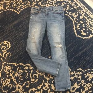 Skinny faded stretch jeans faded and destroyed